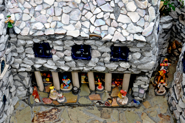close-up of a miniature building and people
