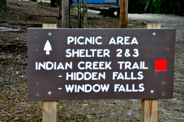 sign for picnic area, trail and falls