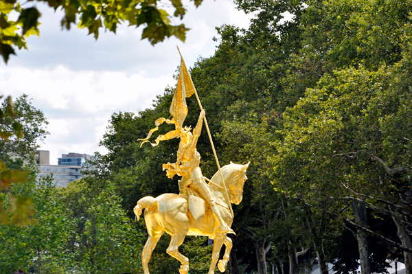 A statue of Joan of Arc riding a horse