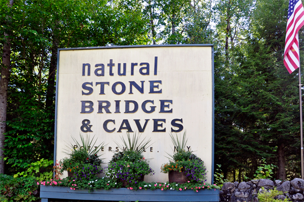Natural Sone Bridge and caves sign