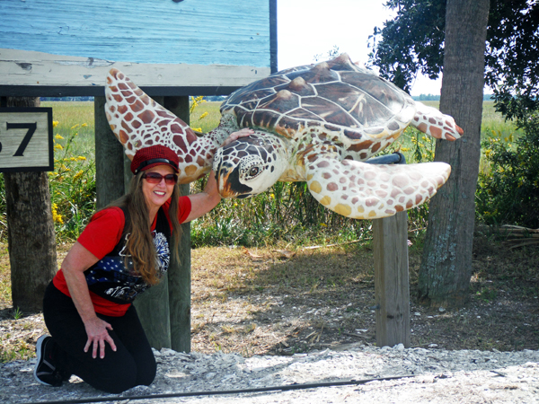 Karen Duquette makes friends with a sea turtle