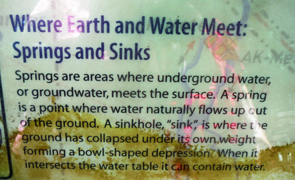 sign about springs and sinkholes