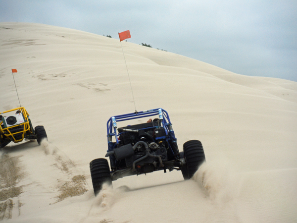 eating the sand from the blue dune buggy