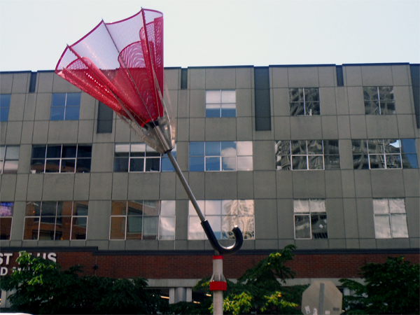 a big red umbrella sculpture
