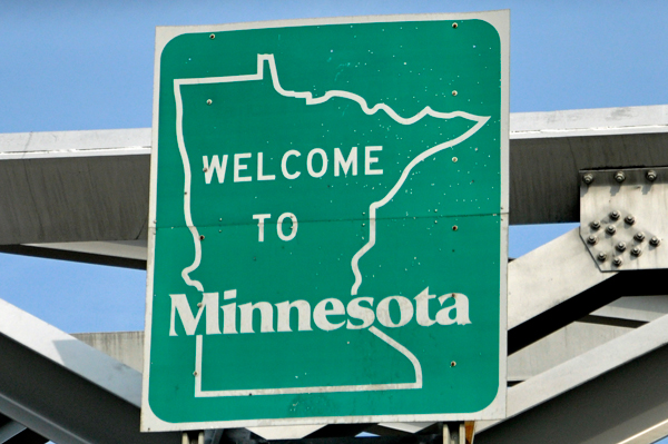 welcome to Minnesota sign on bridge