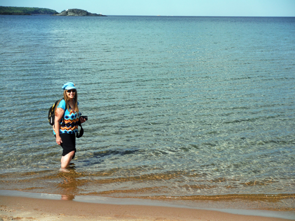 Karen Duquette wading in Lake Superior