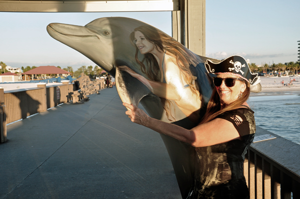 Karen Duquette and a painted dolphin
