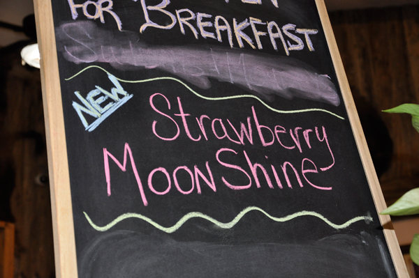strawberry moonshine sign