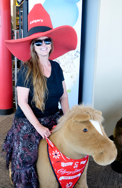 Karen Duquette on a pony inside the Calgary Tower