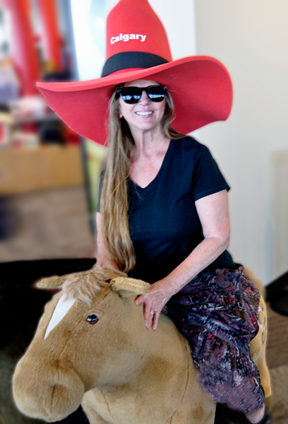 Karen Duquette on a pony inside the Calgary Tower