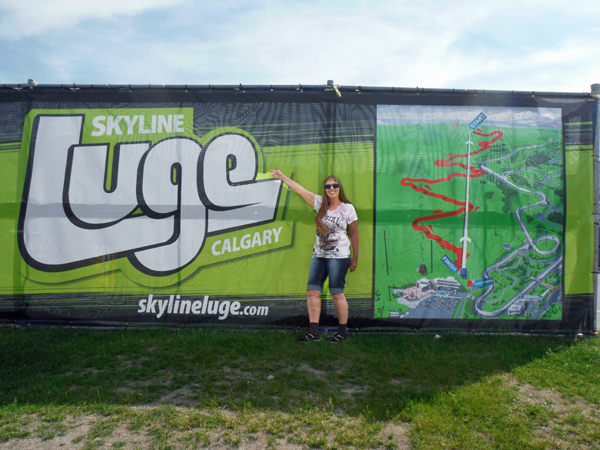 Karen Duquette outside the Skyline Luge sign