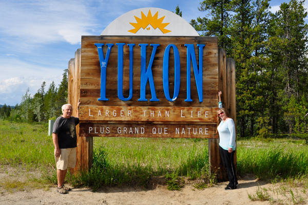 the two RV Gypsies at the Yukon sign