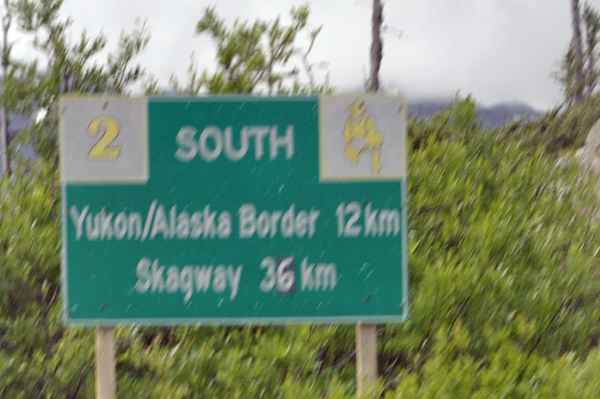 sign: Yukon-Alaska border and Skagway
