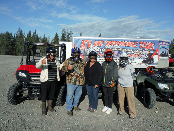 the two RV Gypsies and family ready to ride ATVs