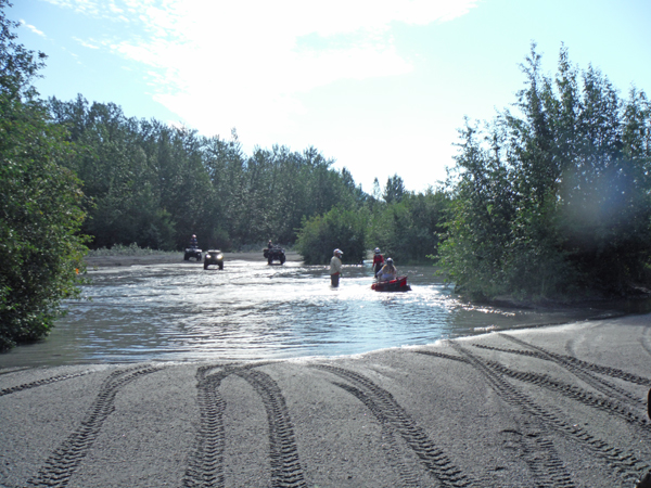 Karen Duquette crossing a third section of the river