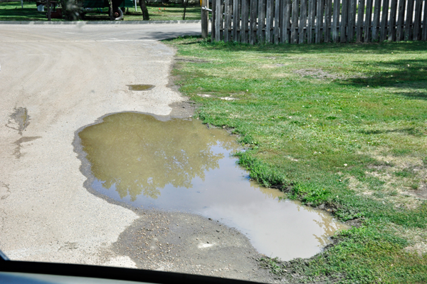 water hole in road at campground