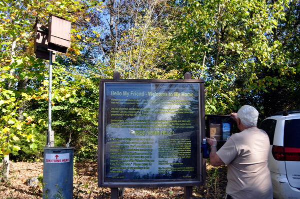 Lee Duquette reading the sign at Burgess Falls State Park