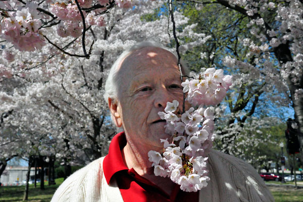 Lee Duquette smelling the Cherry Blossoms