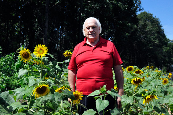 Lee Duquette in a field of sunflowers