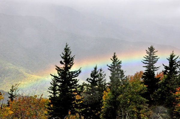 rainbow far below in the valley