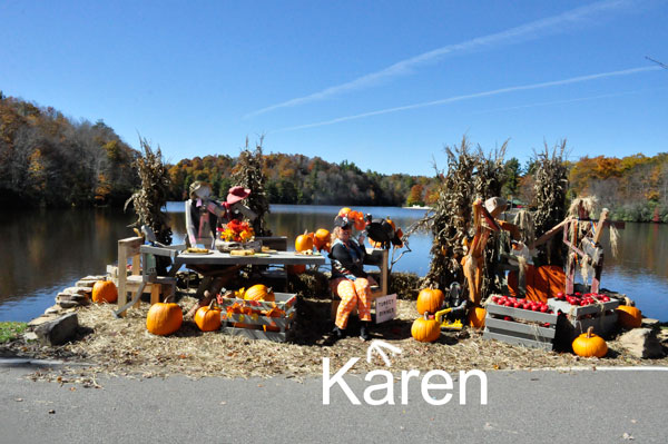 Karen Duquette and a Halloween pumpkin display