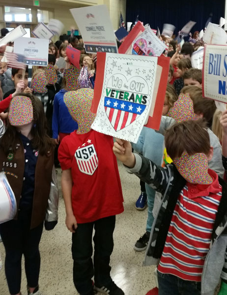 children welcoming the Veterans