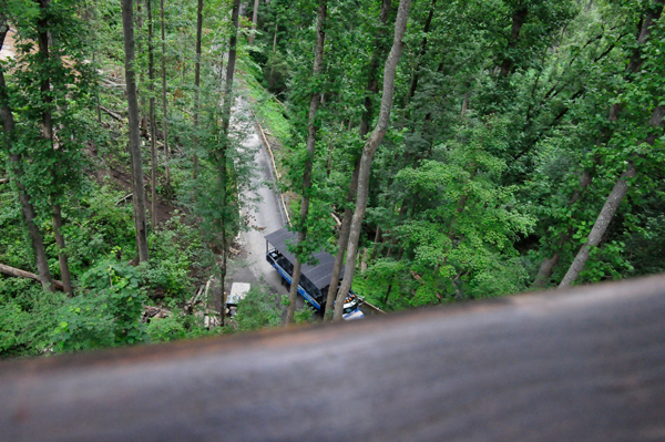 looking down over the side of the swinging bridge