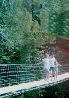 Karen, Lee and their son, Brian on a swinging bridge