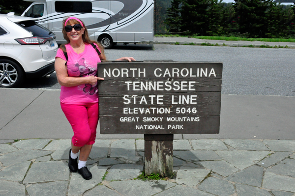 Karen Duquette at the NC-TN state Line sign