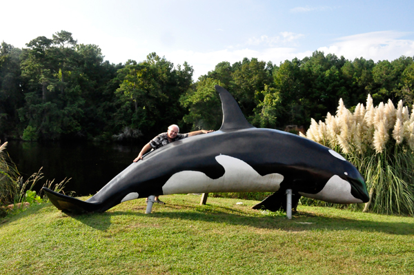 Lee Duquette hugs a big whale