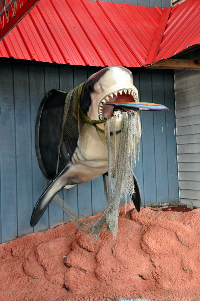 a shark outside of Tommy's Giant Crab Restaurant