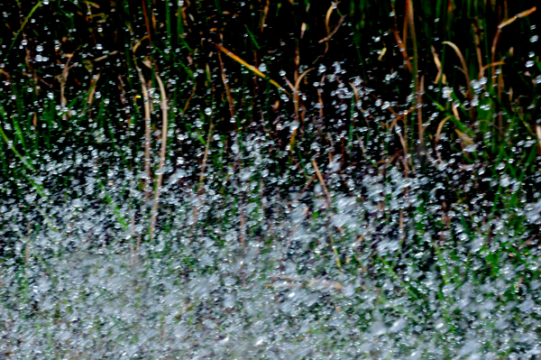 water splashing against the side window of the car