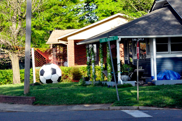 A big soccer ball in someone's yard