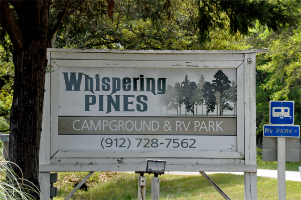 Whispering Pines Campground sign