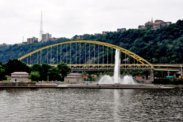 water fountain and yellow bridge