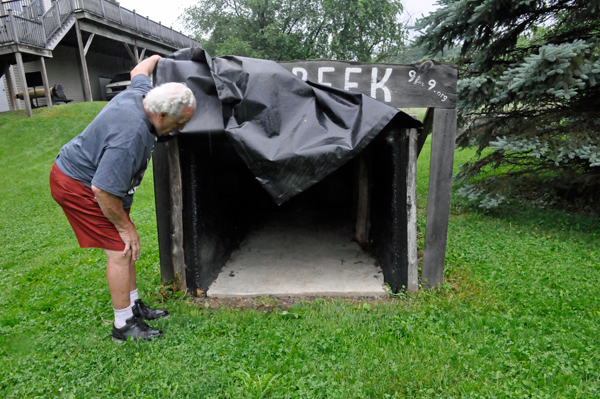 Lee Duquette checking out a mine shaft entrance replica