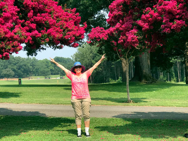 Karen Duquette and the red flowering trees