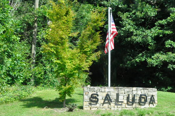 Saluda sign and an American flag