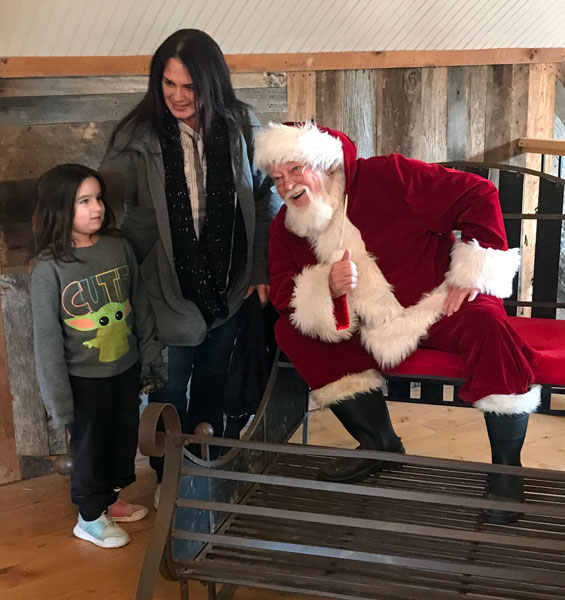 Renee and her granddaughter with Santa