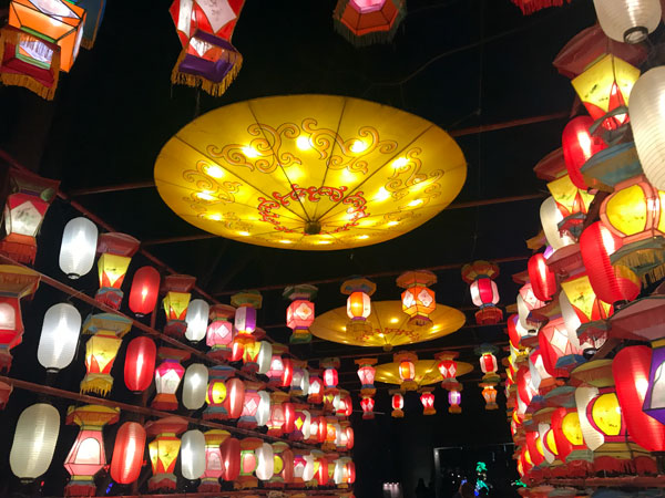 entry way lined with Chinese Lanterns