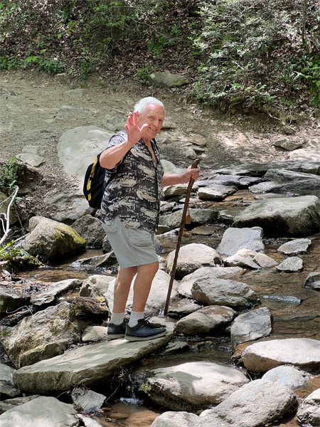 Lee Duquette crossing the creek