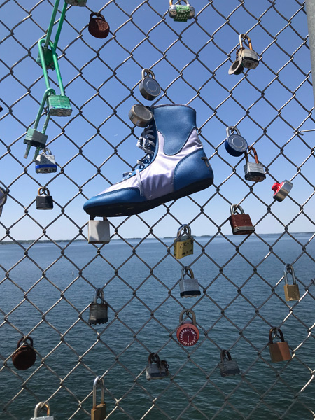 a big shoe on the fence