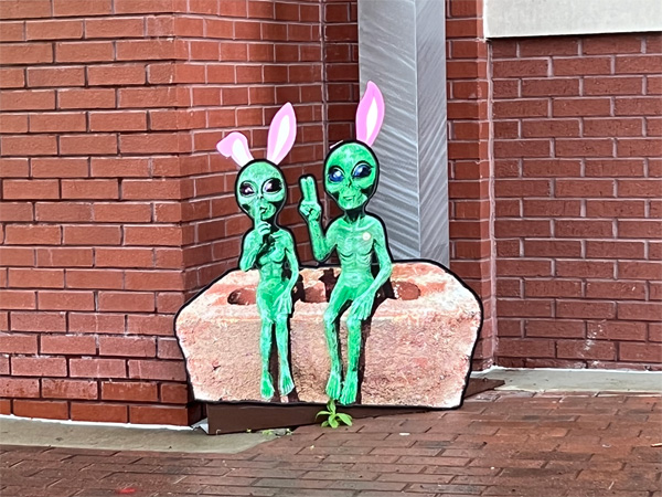 two green aliens with rabbit ears