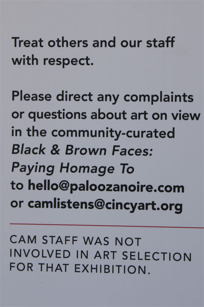 Black and Brown Faces sign