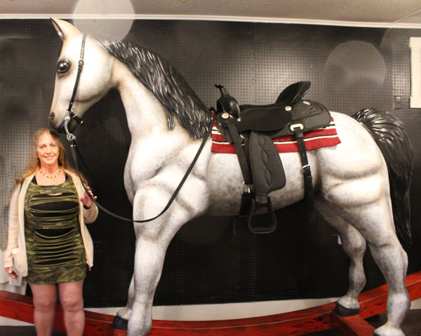Karen Duquette and the big rocking horse 