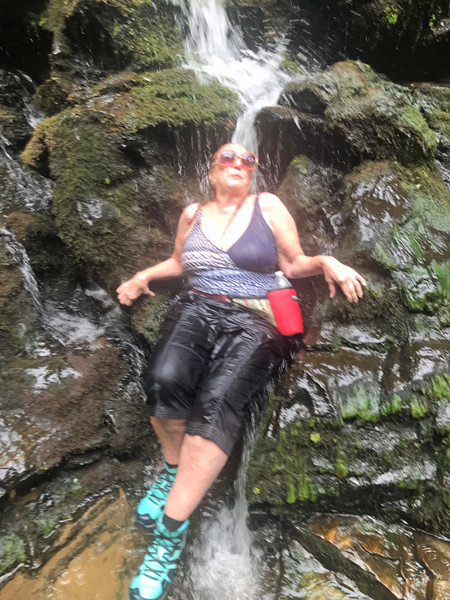 Karen Duquette under the waterfall
