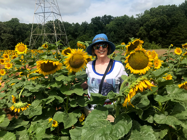 Karen Duquette in the Sunflower field