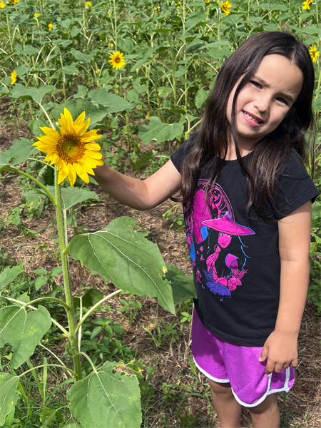 great-granddaughter with a sunflower