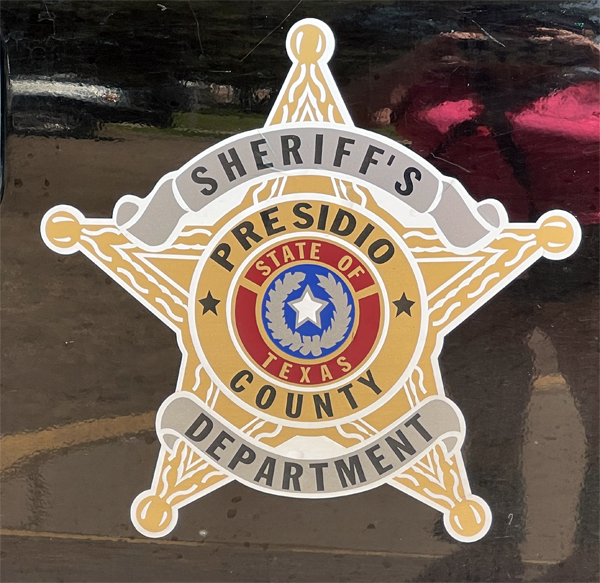 sign on the side of a Sheriff's car