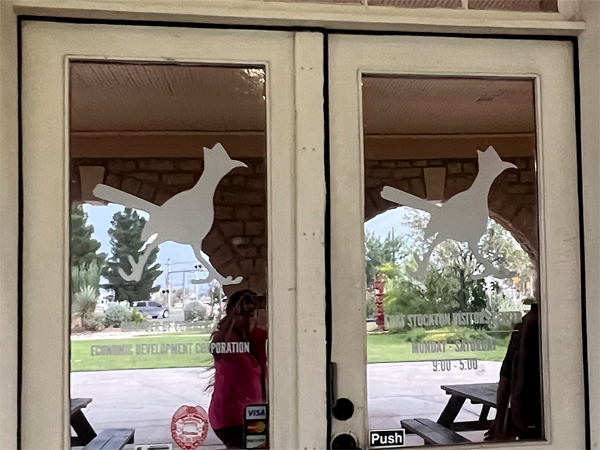 roadrunners on the door at the Visitor Center
